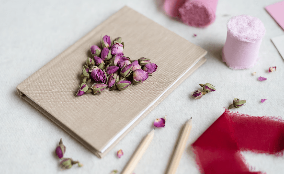 Journal cover with heart-shaped dried roses cover.png