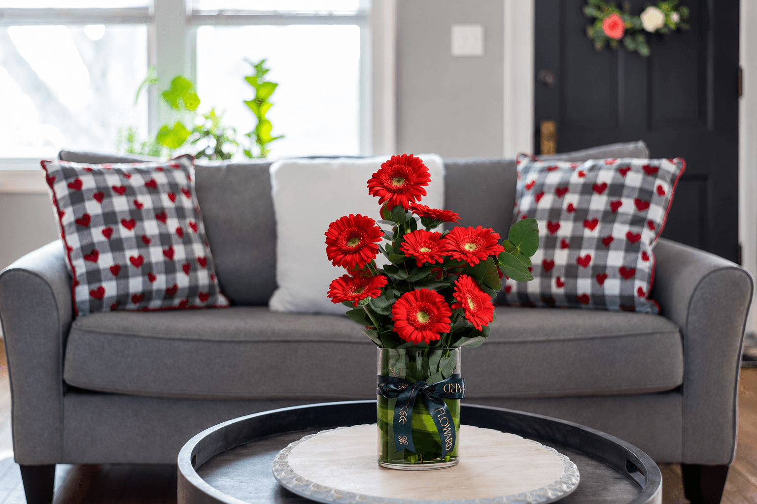 Red gerbera vase from Floward online flowers and gifts.png