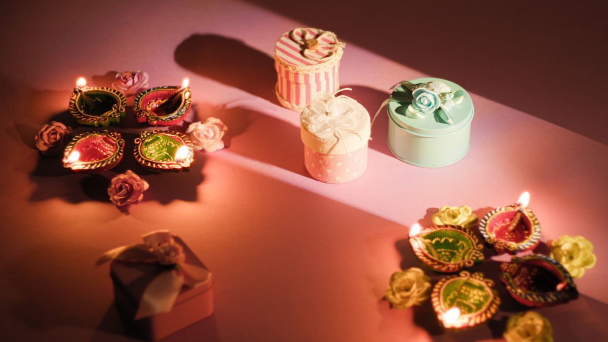 diwali-celebration-with-candles-flowers-and-gift.jpg