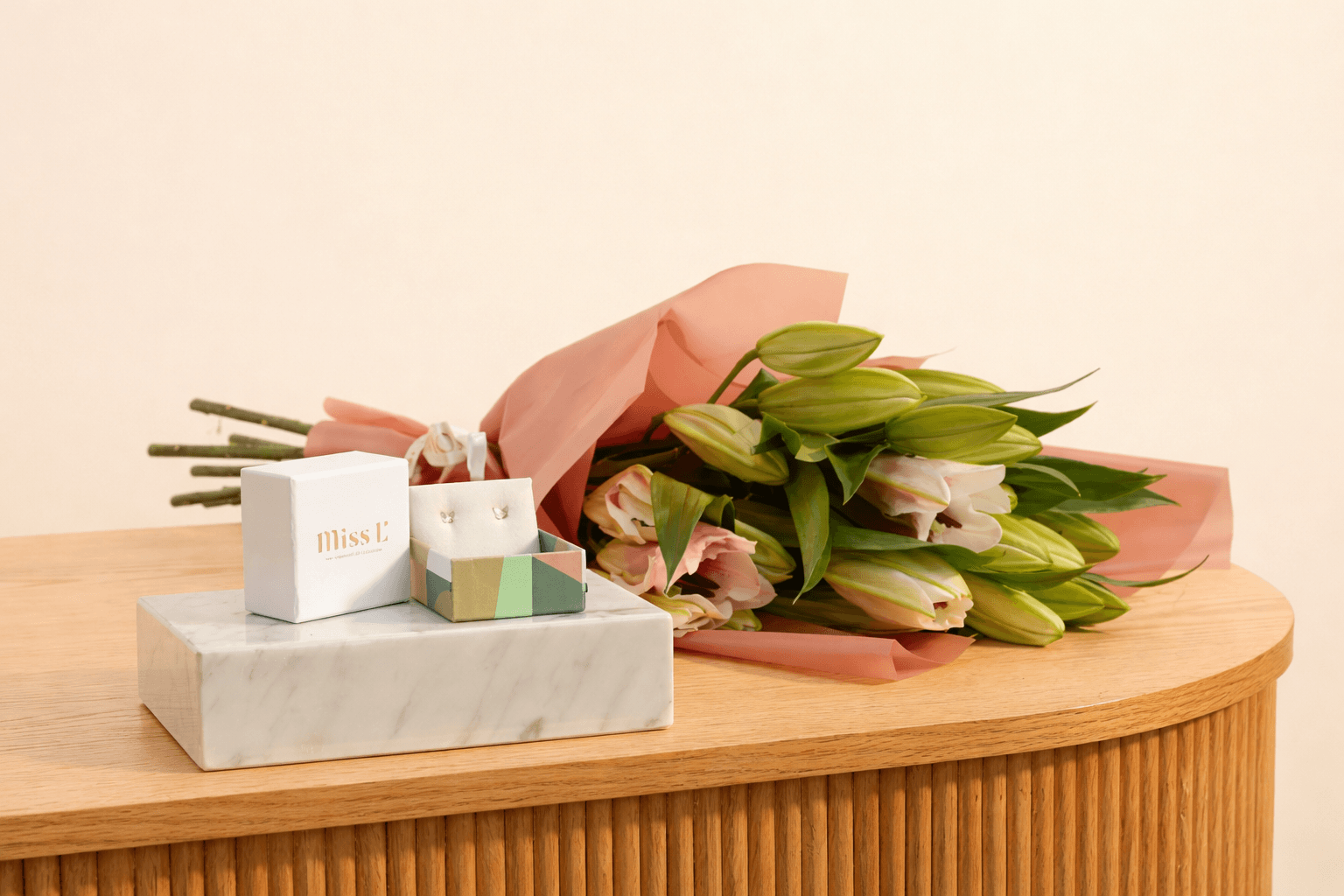 miss L baby jewelry gift with lilies bouquet.png