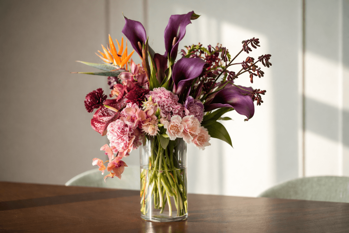 purple calla lily vase arrangement.png