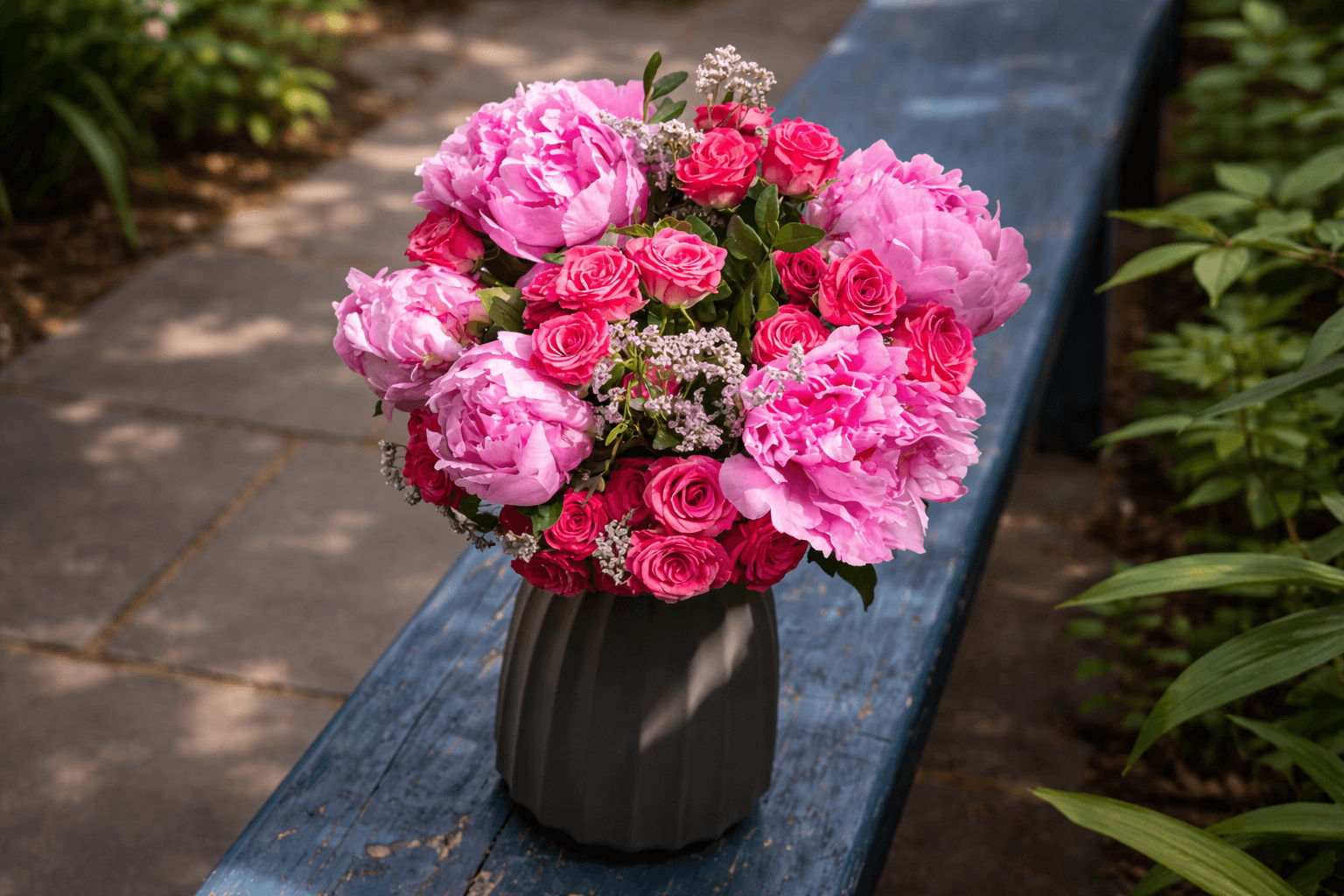 red roses and pink peonies in ceramic vase - Floward.png