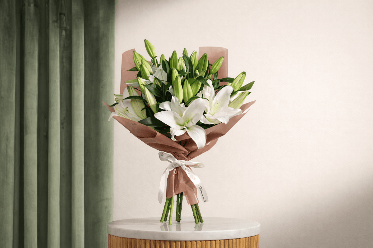 white lilies flower bouquet for sisters.png